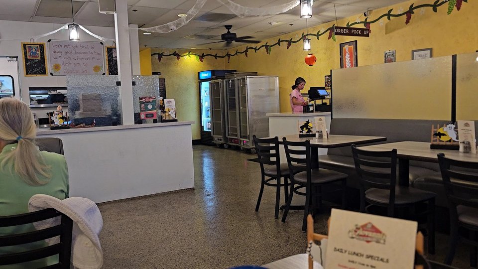 Pizza slices beside a salad bar.